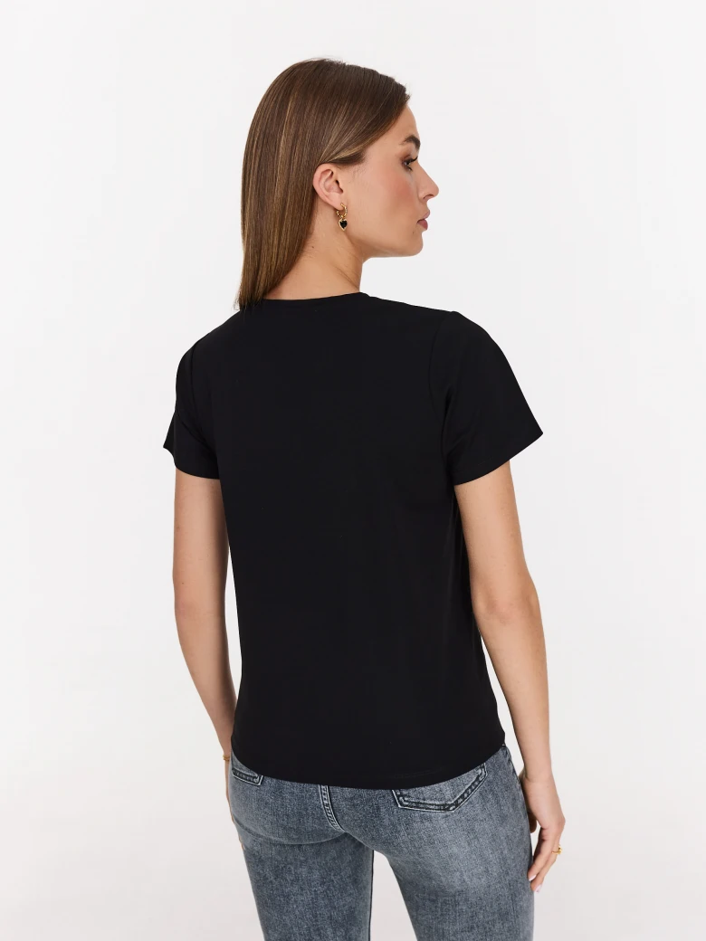 Black blouse with short sleeves and floral appliqué