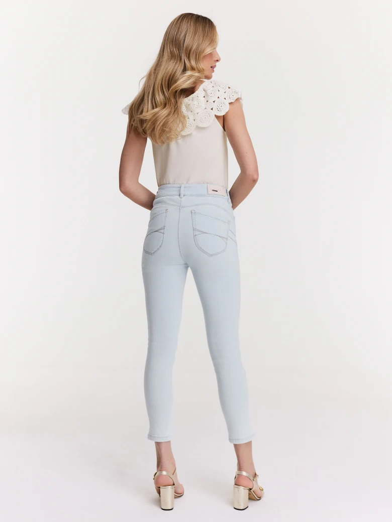 White blouse with lace embellishment at the neckline