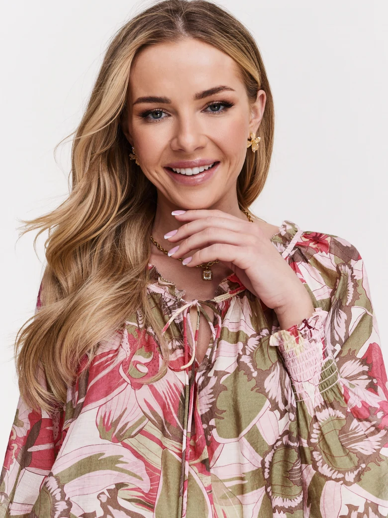 Pink blouse with floral pattern