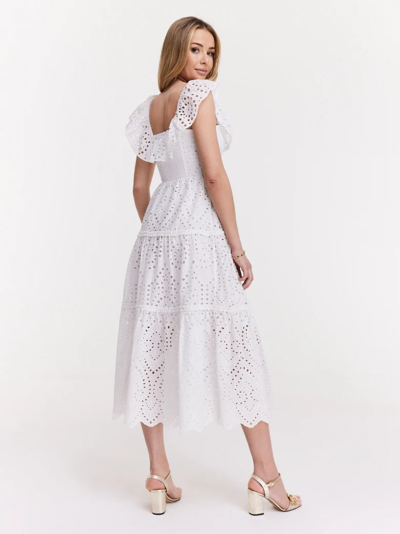 Delicate dress made of thin embellished fabric