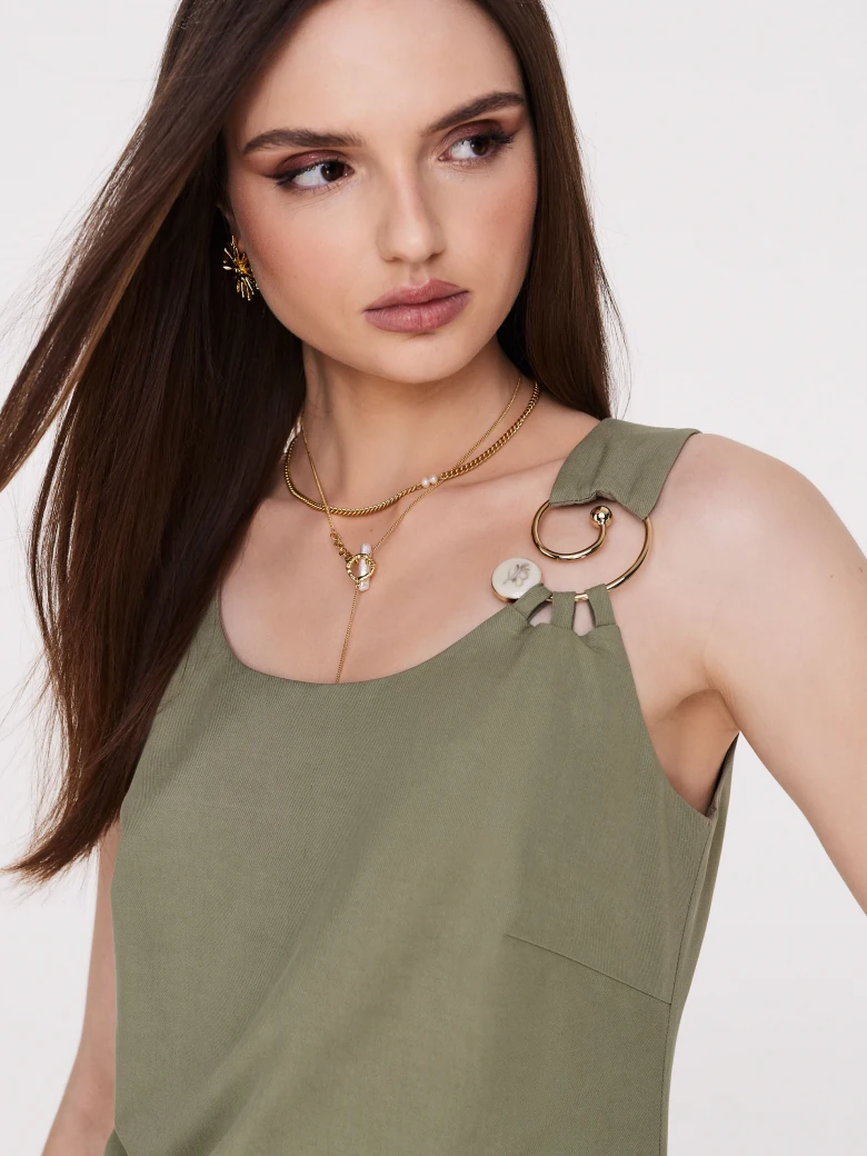 Green minimalist dress with decorative clutch