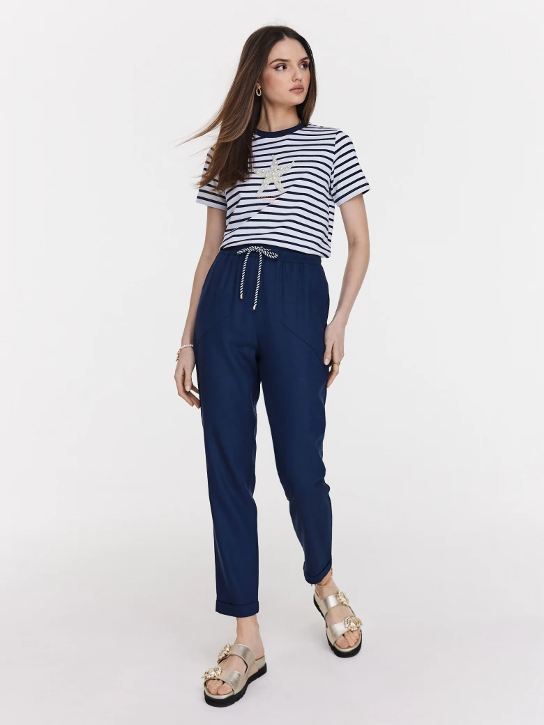 Navy blue pants with rolled up legs