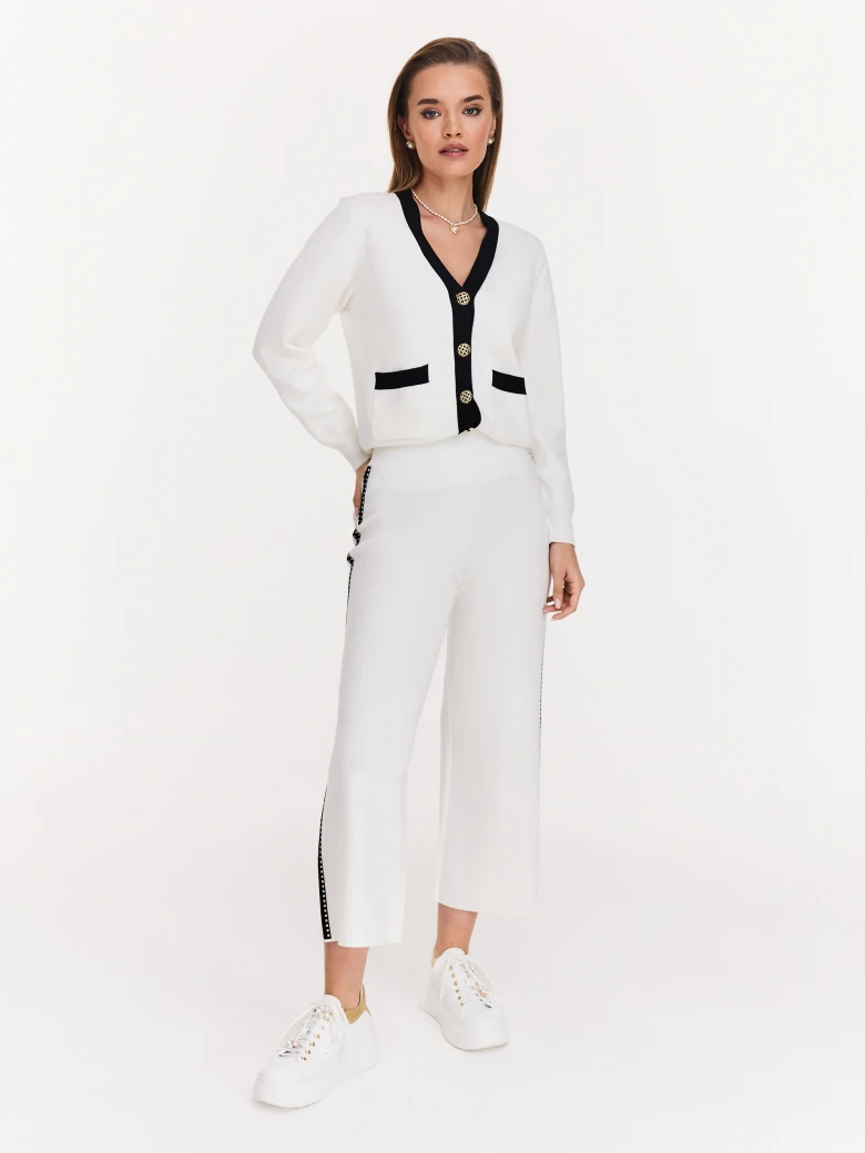 Cream high-waisted pants with black piping