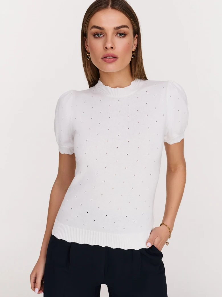 White buffet sweater with openwork embellishments