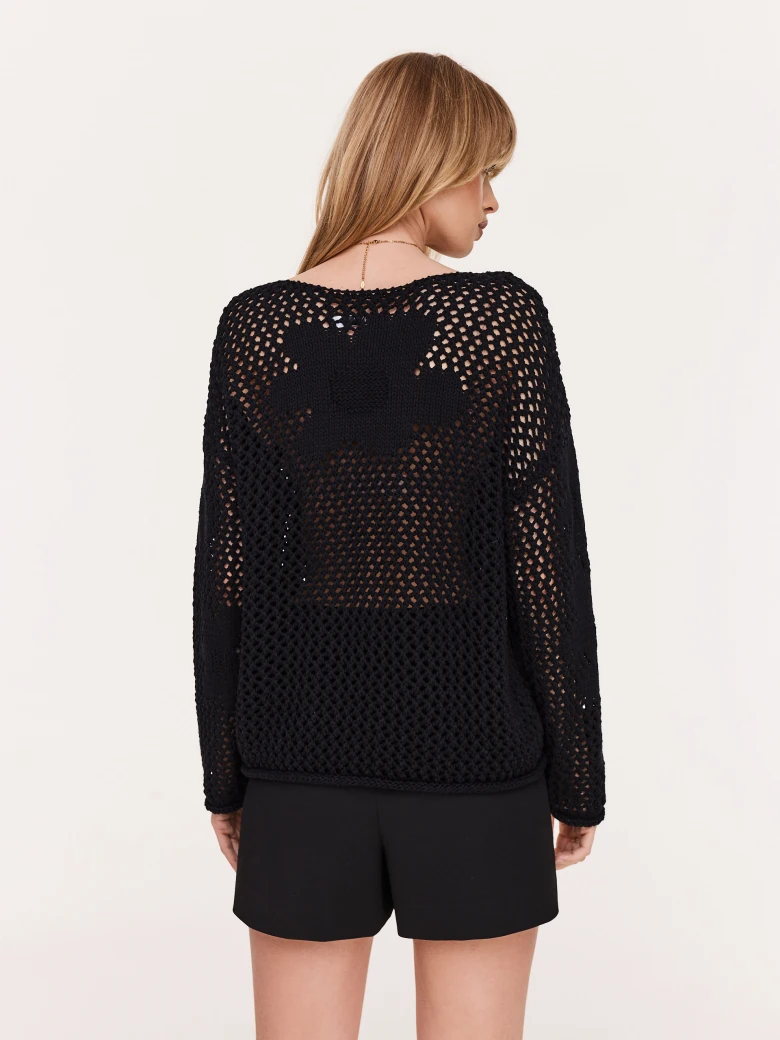 Openwork black sweater with floral elements