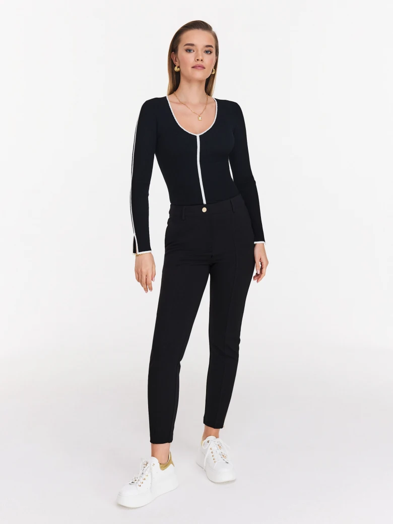 Fitted black sweater with trimmings
