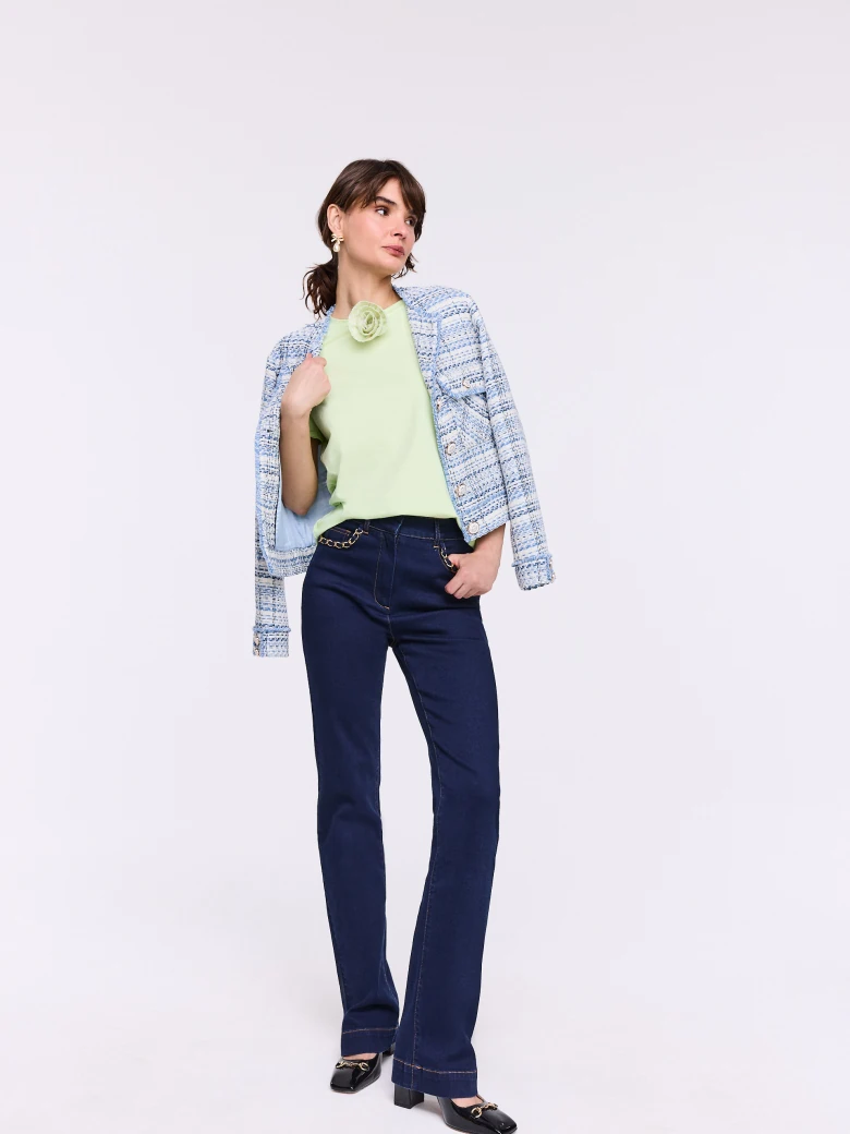 Lime short-sleeved blouse with a flower-shaped brooch