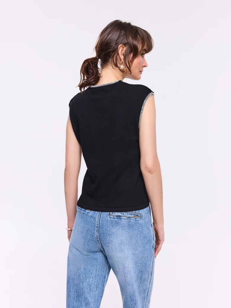 Black sleeveless top with decorative trim