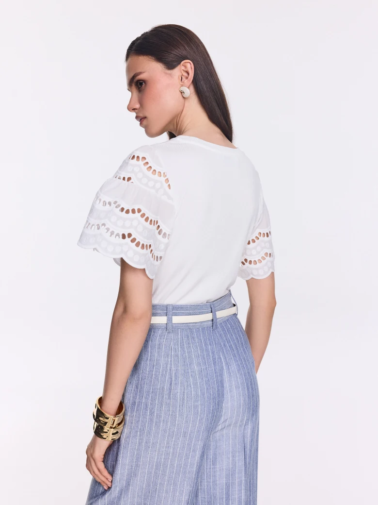 White blouse with openwork puff sleeves