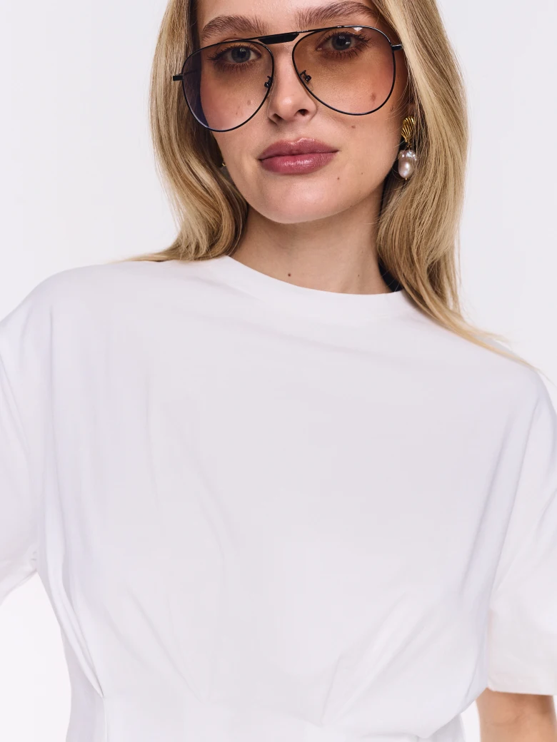 White cotton blouse with a peplum