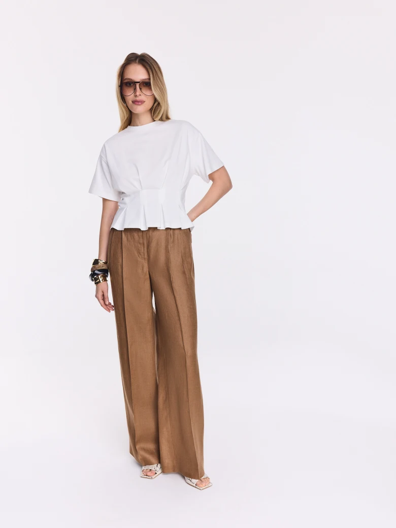 White cotton blouse with a peplum