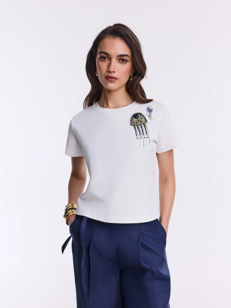 White cotton T-shirt with beaded brooches