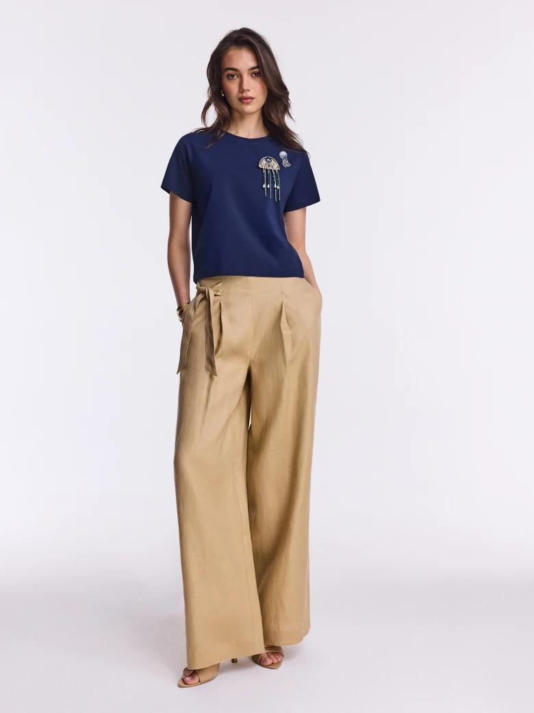 Navy blue cotton blouse with beaded brooches