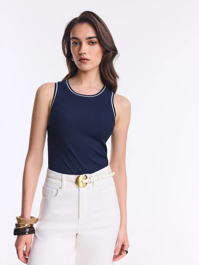 Fitted navy blue top with white trim