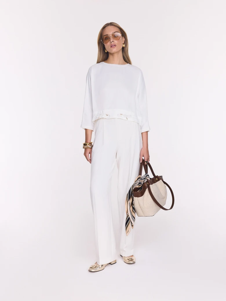 White elegant blouse made of satin viscose