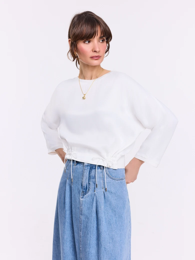 White elegant blouse made of satin viscose