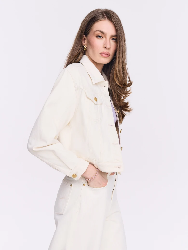 Cream denim jacket with gold buttons