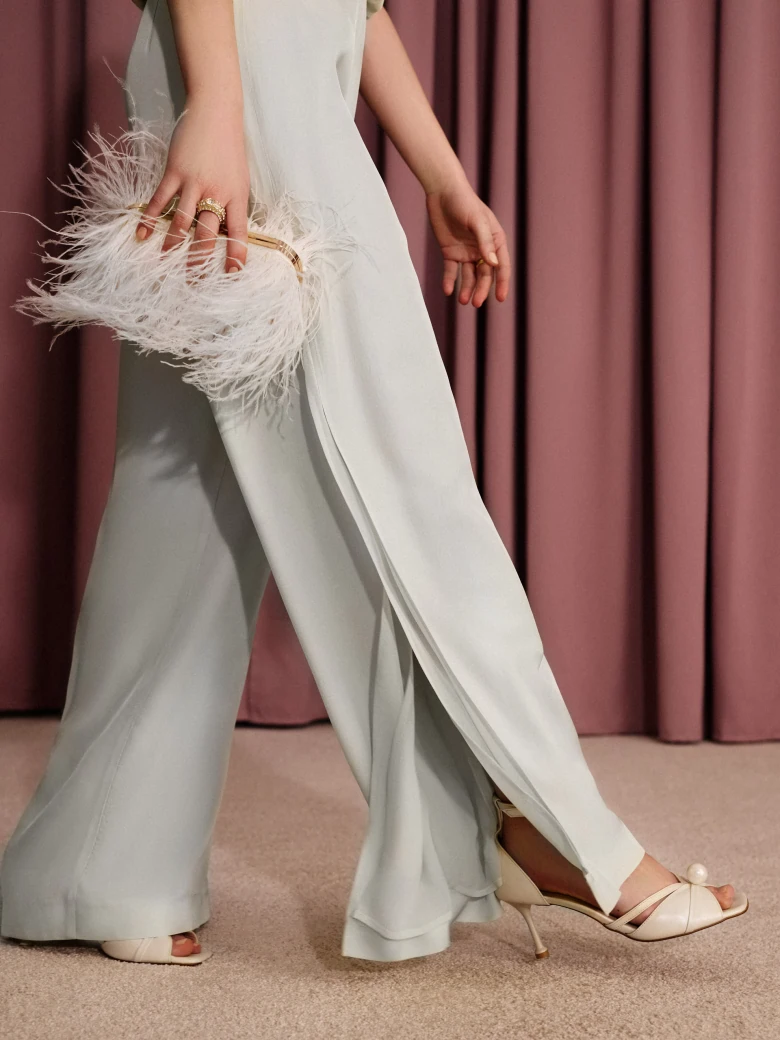 Wide-leg pants with a slit in a pastel mint shade