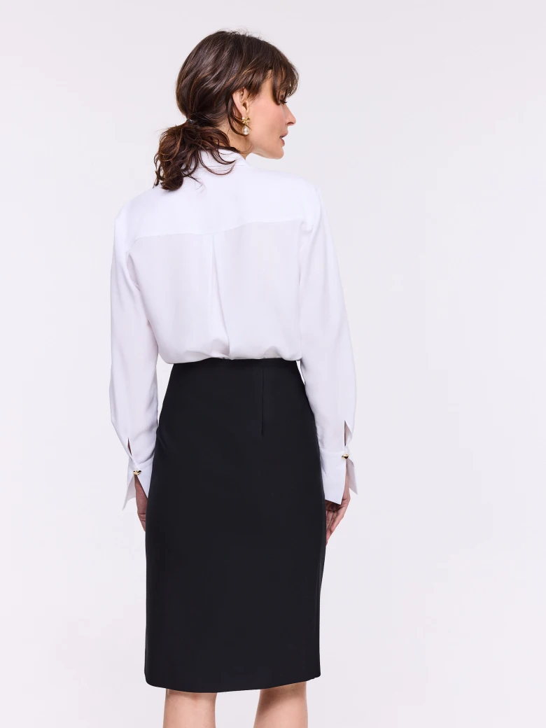 Black high-waisted skirt with decorative buttons