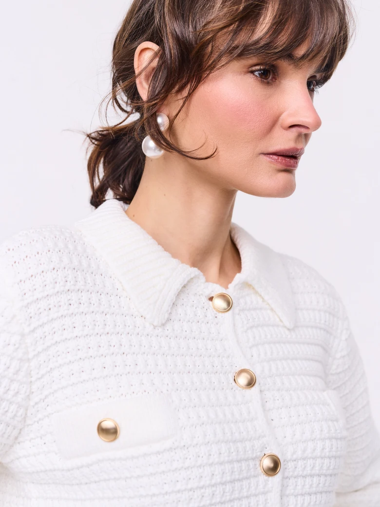 Knitted sweater with decorative buttons and collar