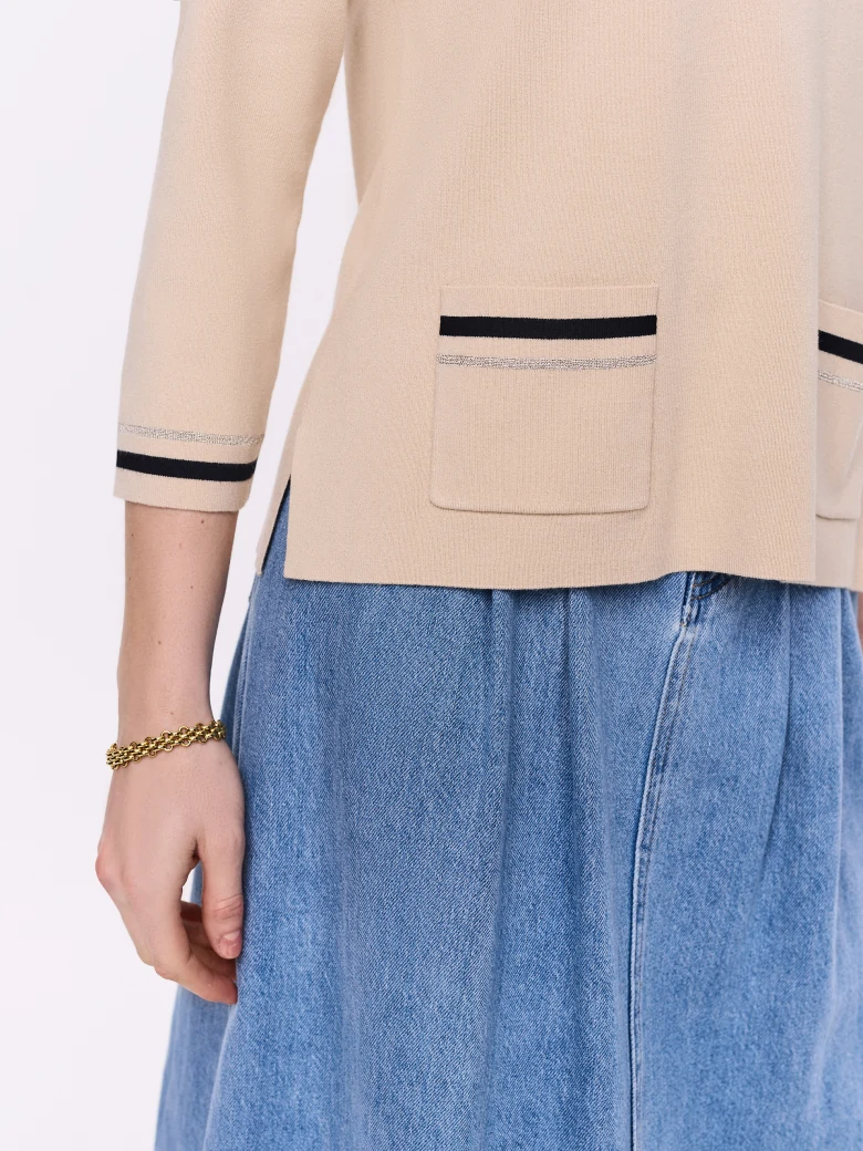 Light beige sweater with decorative trim