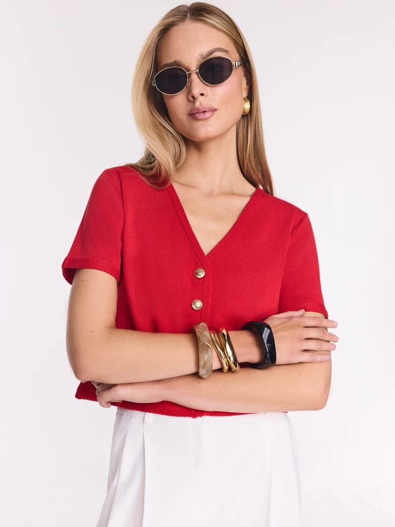 Red sweater with decorative buttons