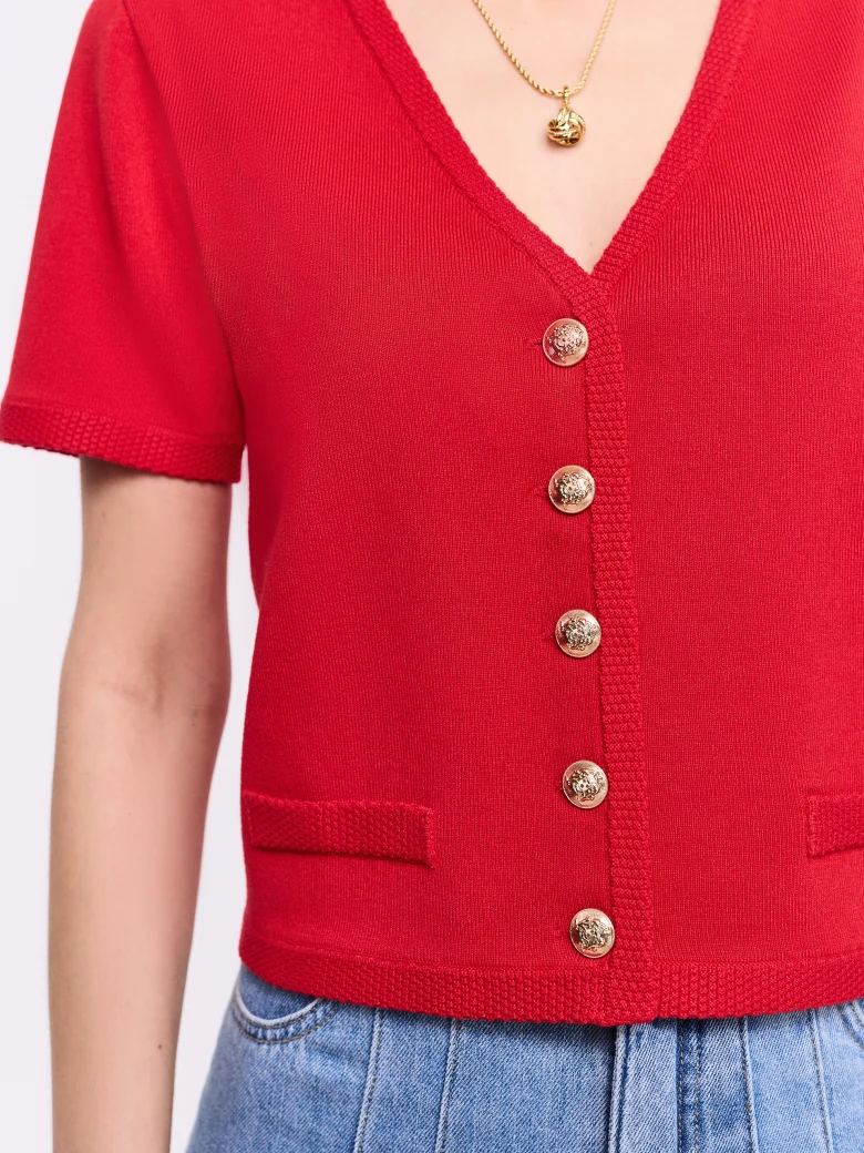 Red sweater with decorative buttons