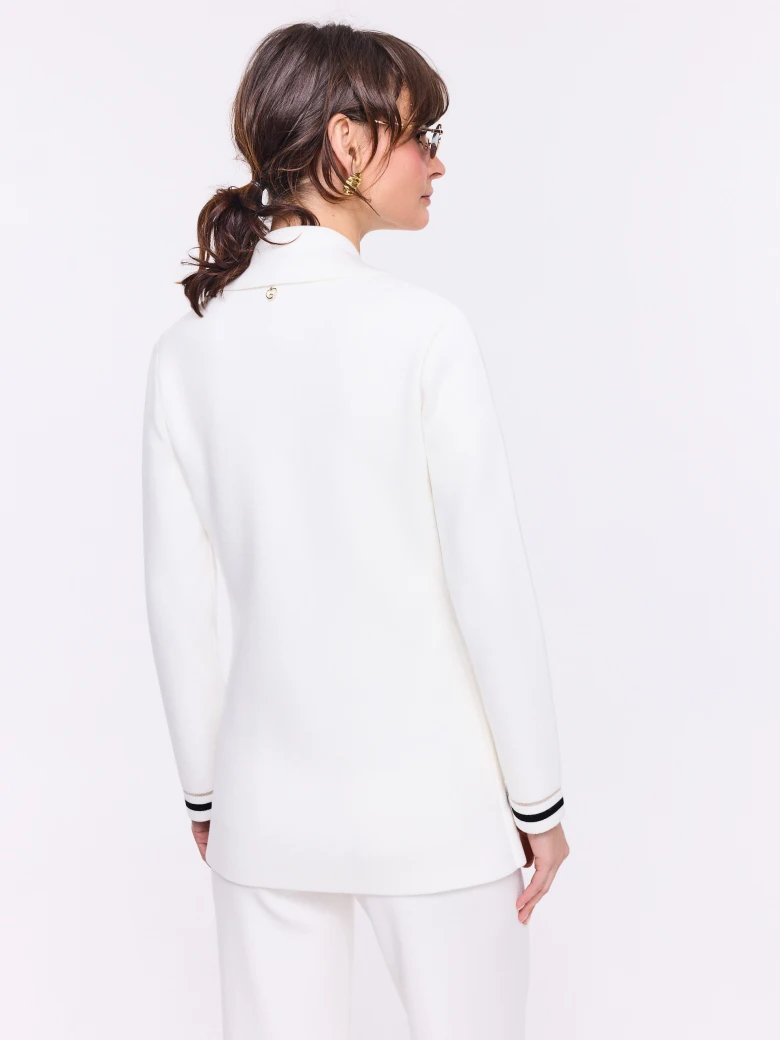 Cream double-breasted jacket with decorative piping