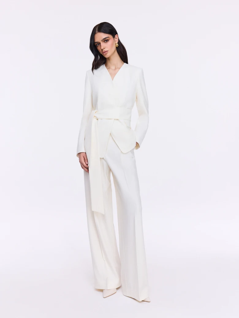 Elegant cream trousers with a gold button