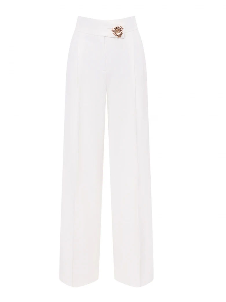Elegant cream trousers with a gold button