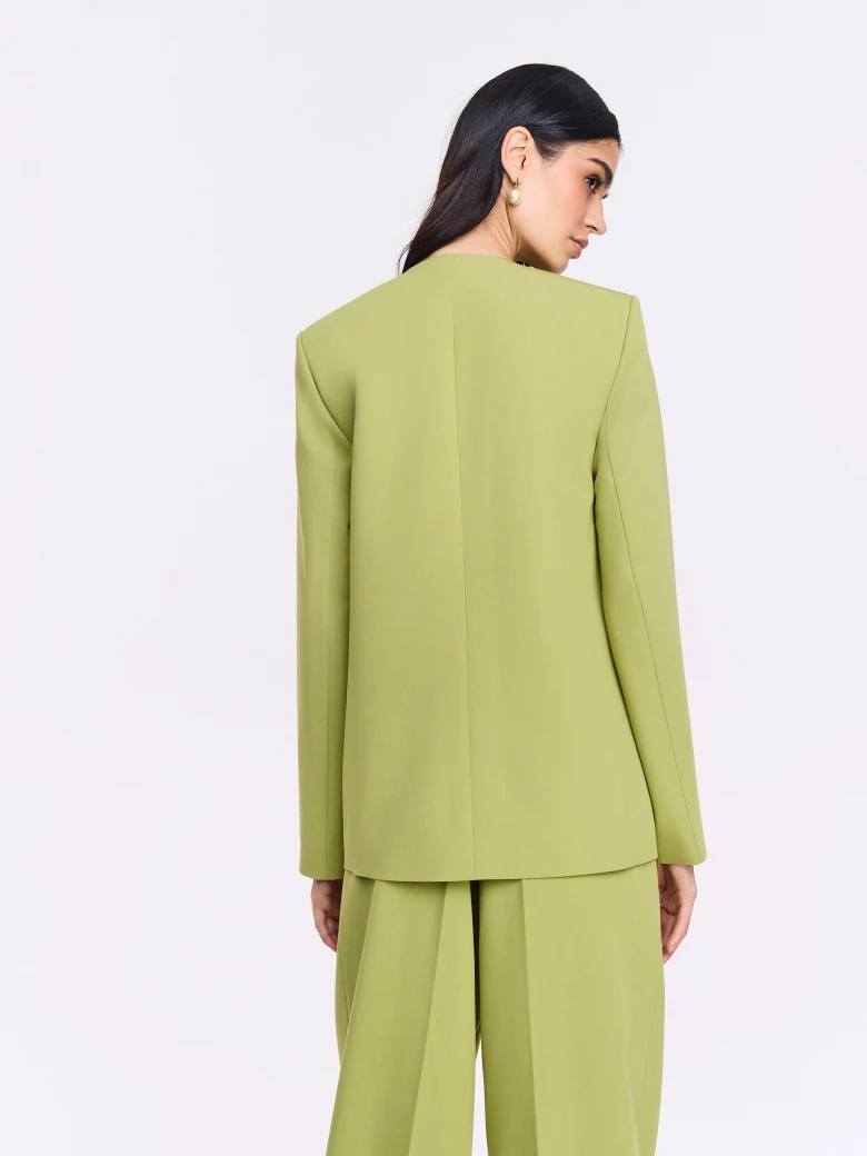 Green jacket with a sash and a jeweled button