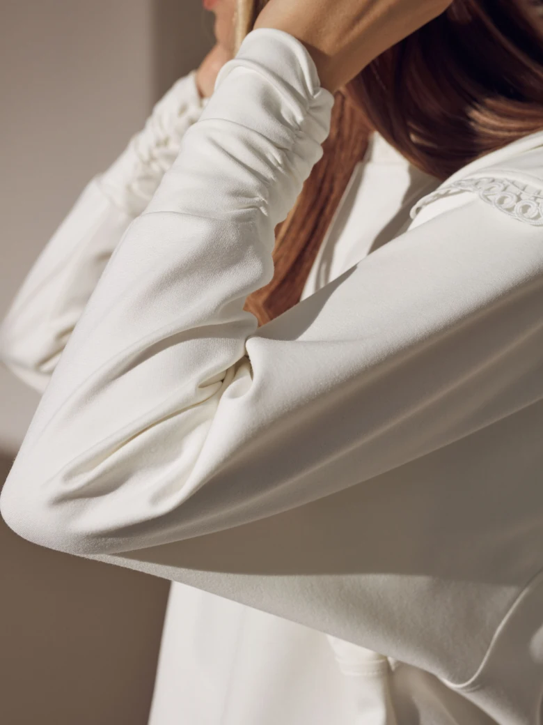 White blouse with pleats and frill