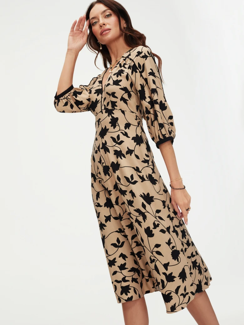 Beige dress with black leaves print