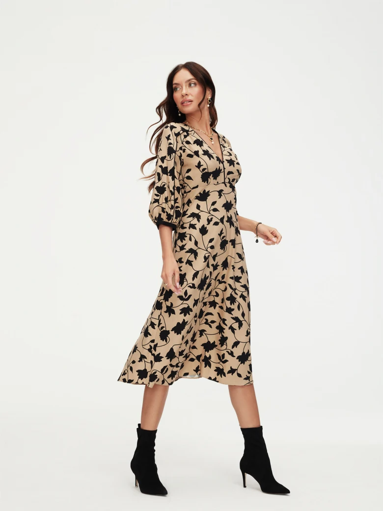 Beige dress with black leaves print