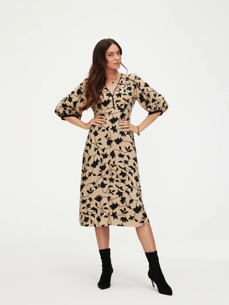 Beige dress with black leaves print