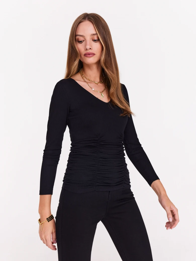 Black blouse with V neckline and back cutout