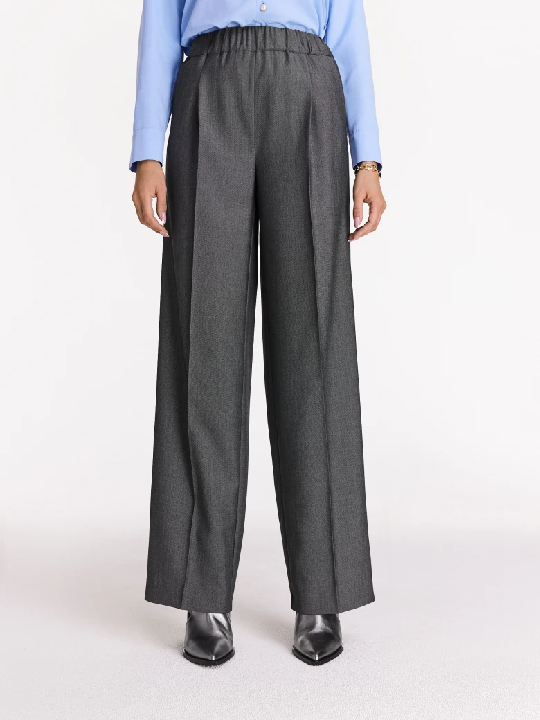 Grey high-waisted pants with elastic waistband