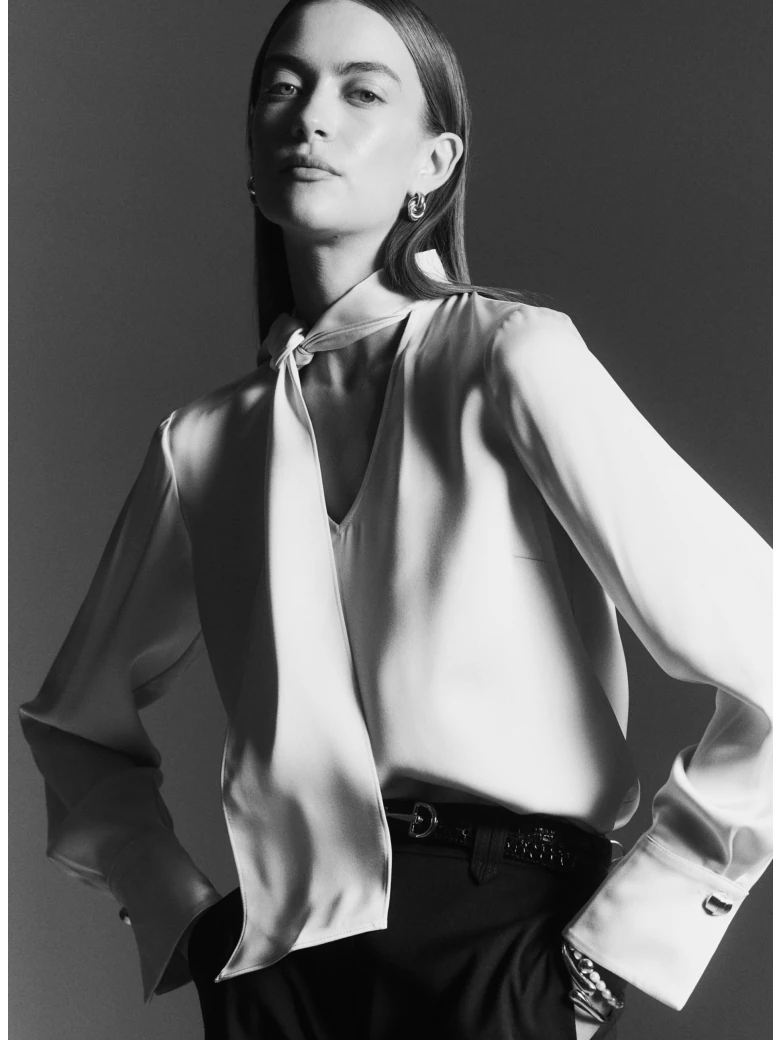 Cream blouse with a tie at the neck
