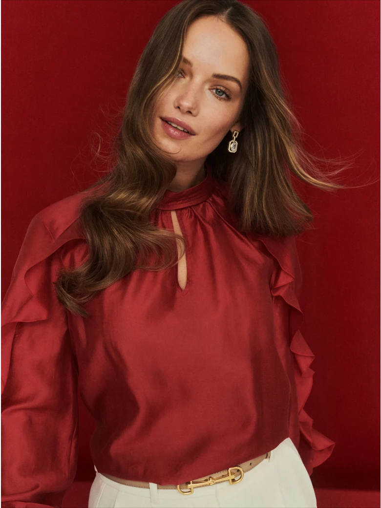 Red satin blouse with decorative ruffles