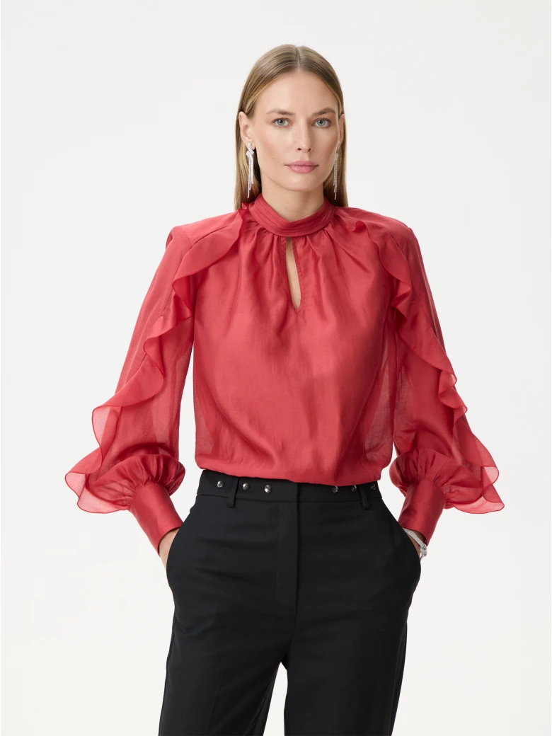 Red satin blouse with decorative ruffles