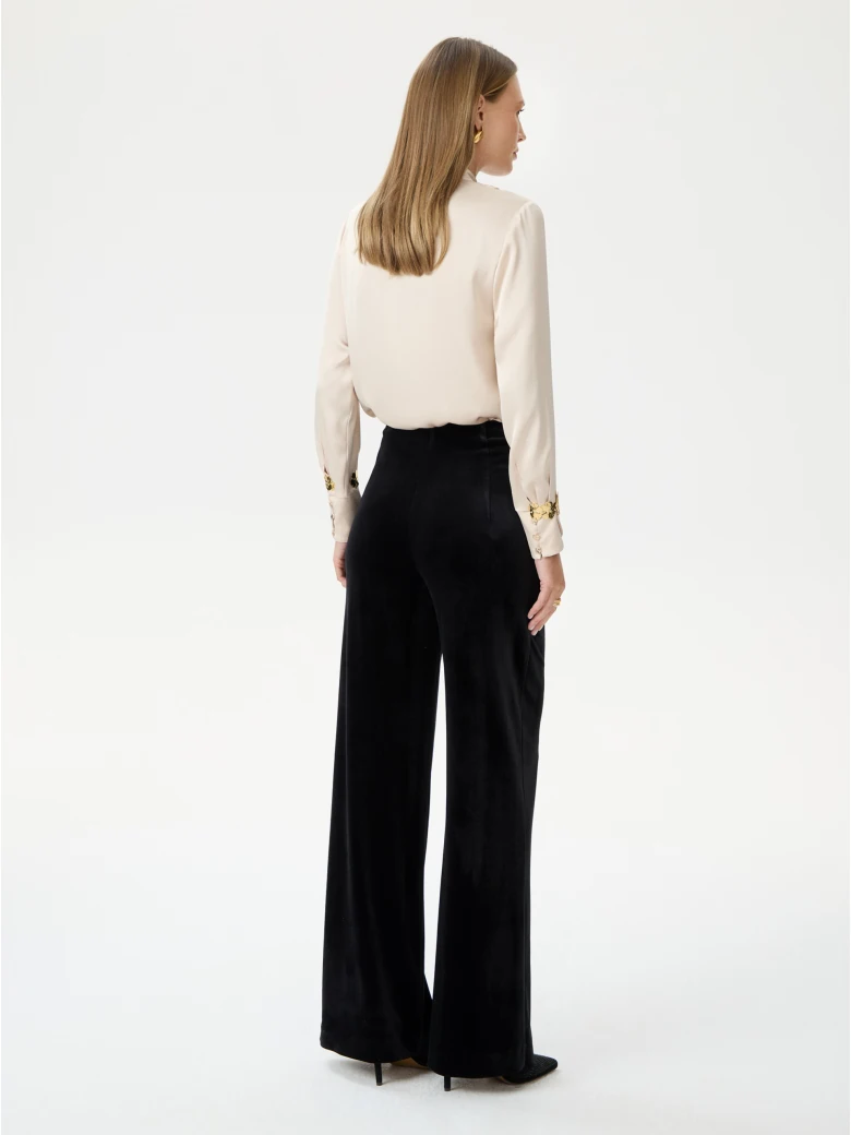 High-waisted black velour pants