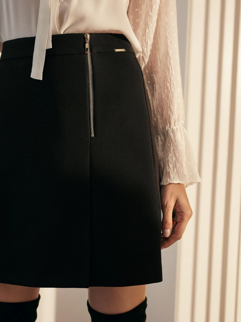 TRAPEZE SKIRT WITH CUT-OUTS