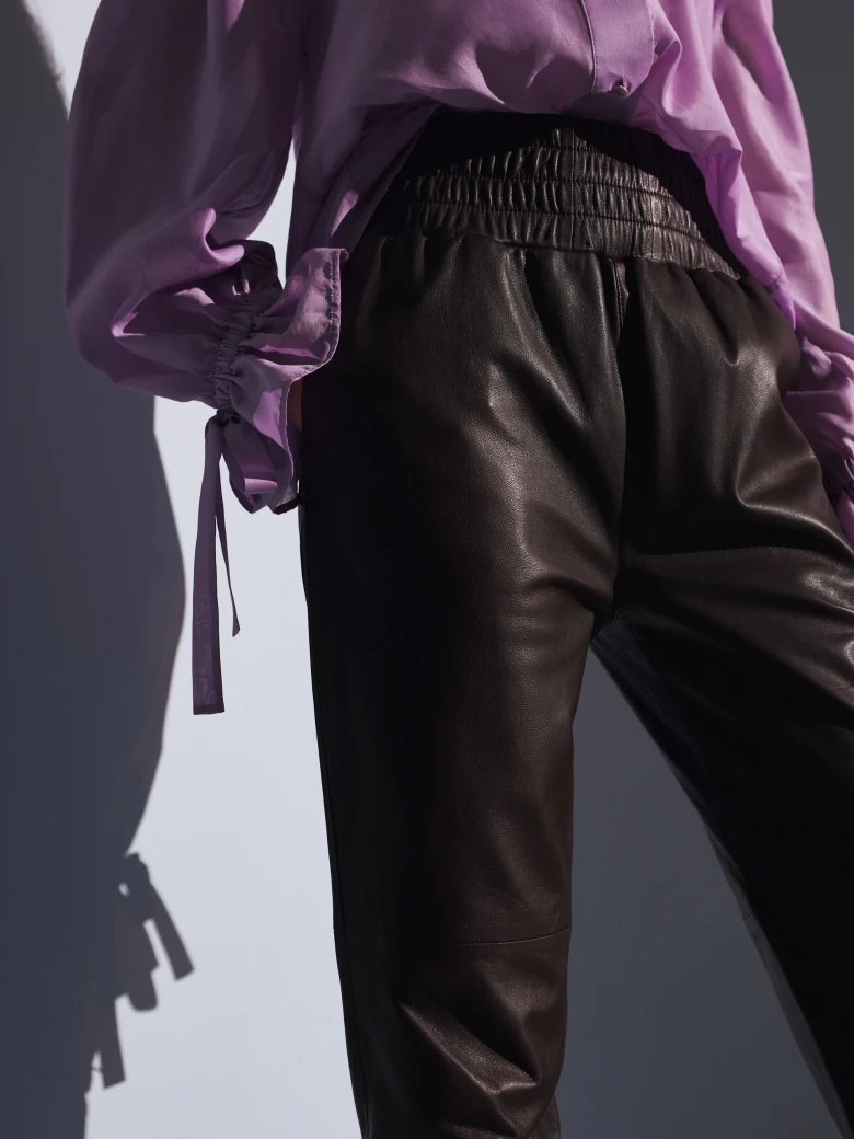 Brown leather pants with elastic waistband