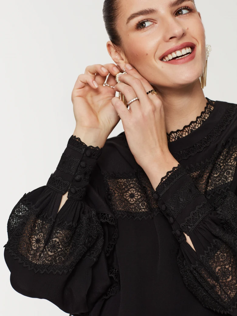 Black blouse with lace inserts