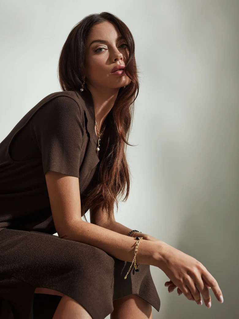 Long brown sleeveless sweater