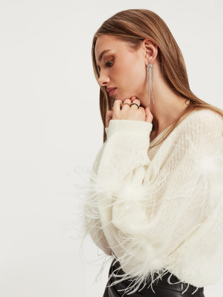 Beige sweater with ostrich feathers