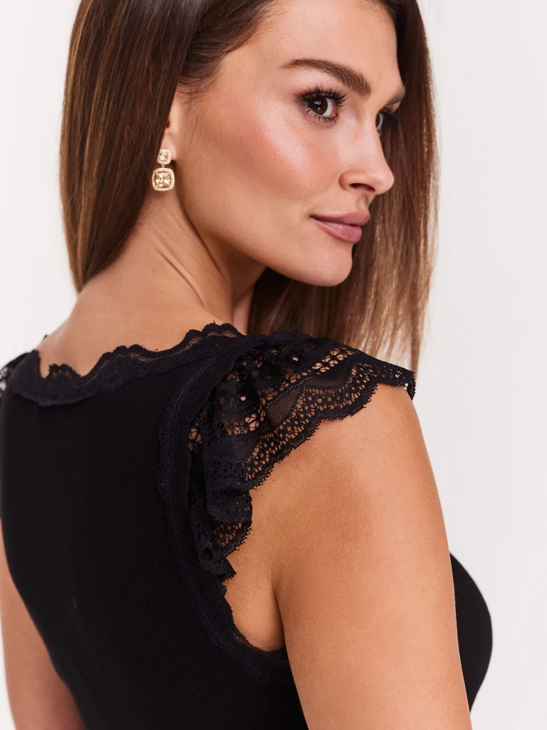 Black blouse with lace inserts