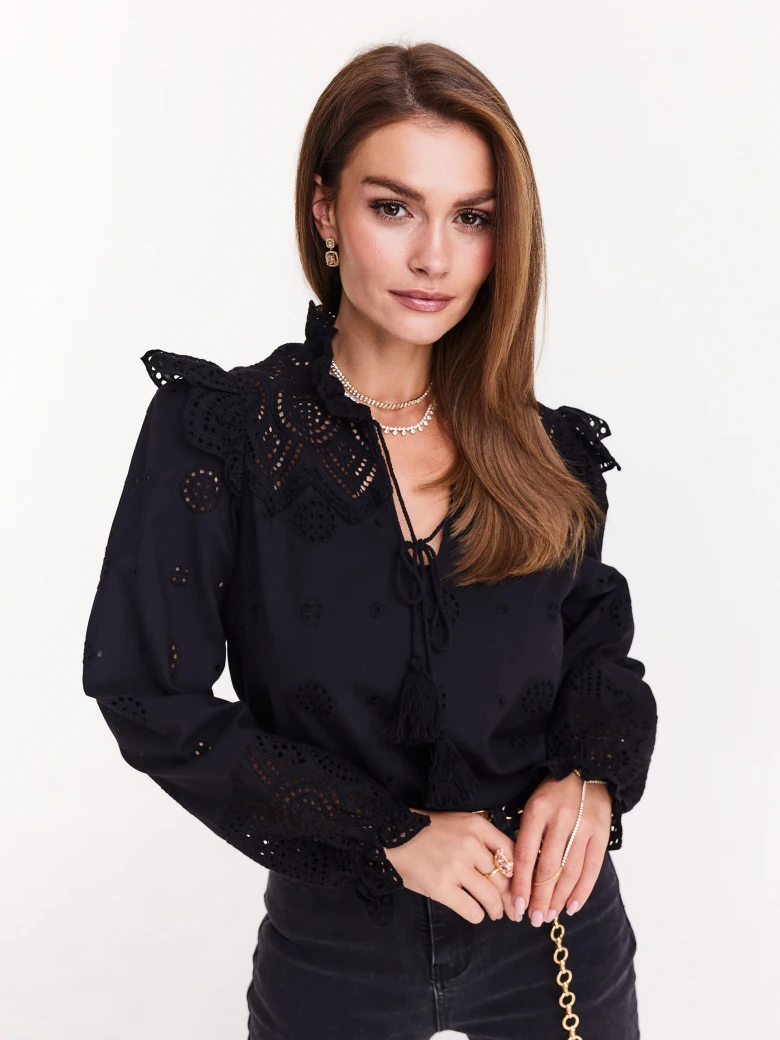 Black blouse with openwork inserts