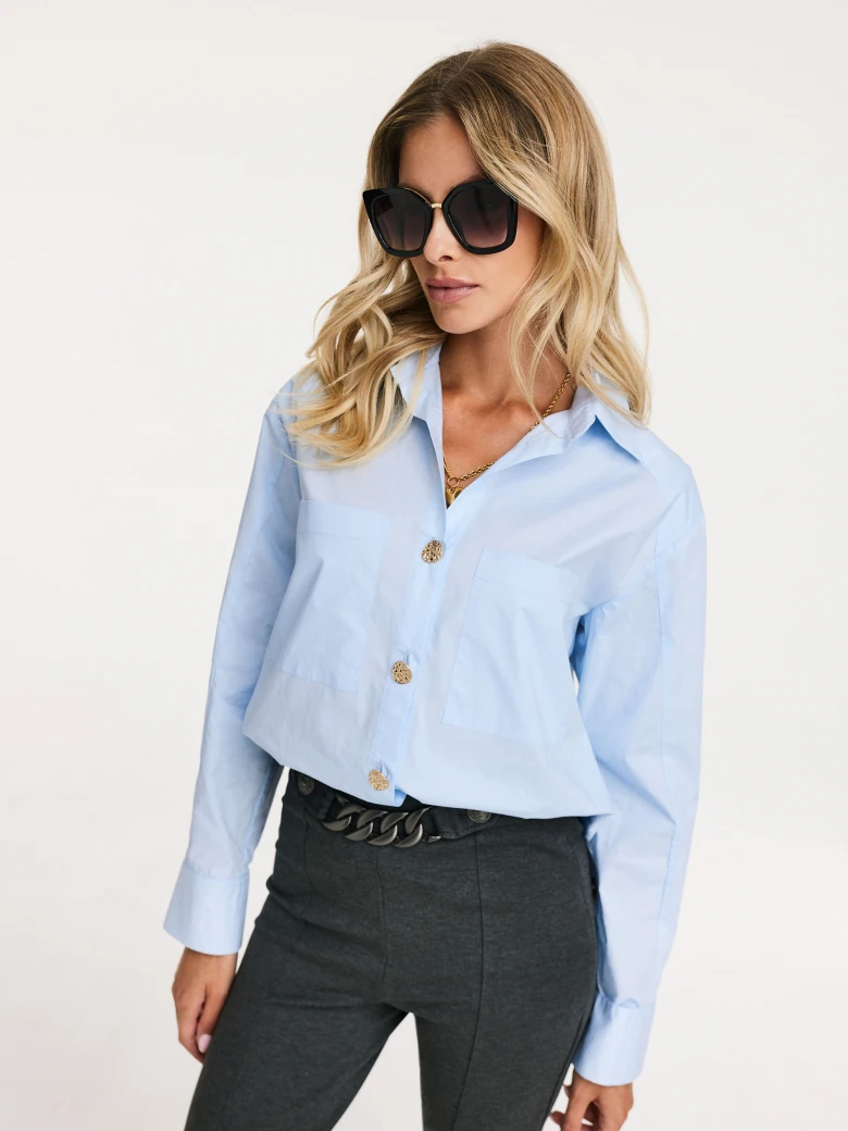 Blue shirt with decorative buttons