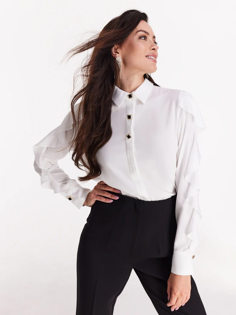 Elegant white shirt with ruffles on the sleeves